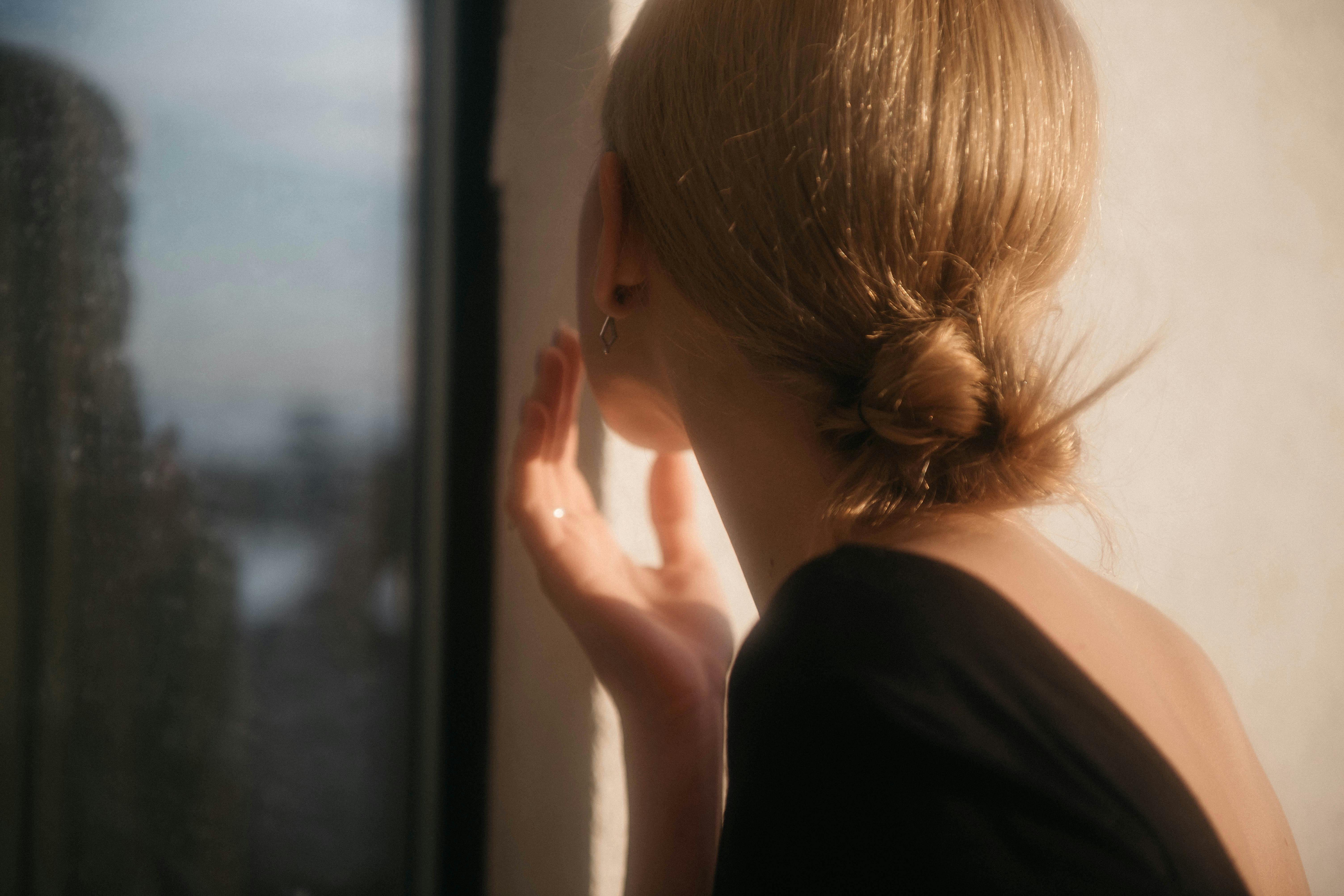 how to move forward after infidelity - a women looking out the window